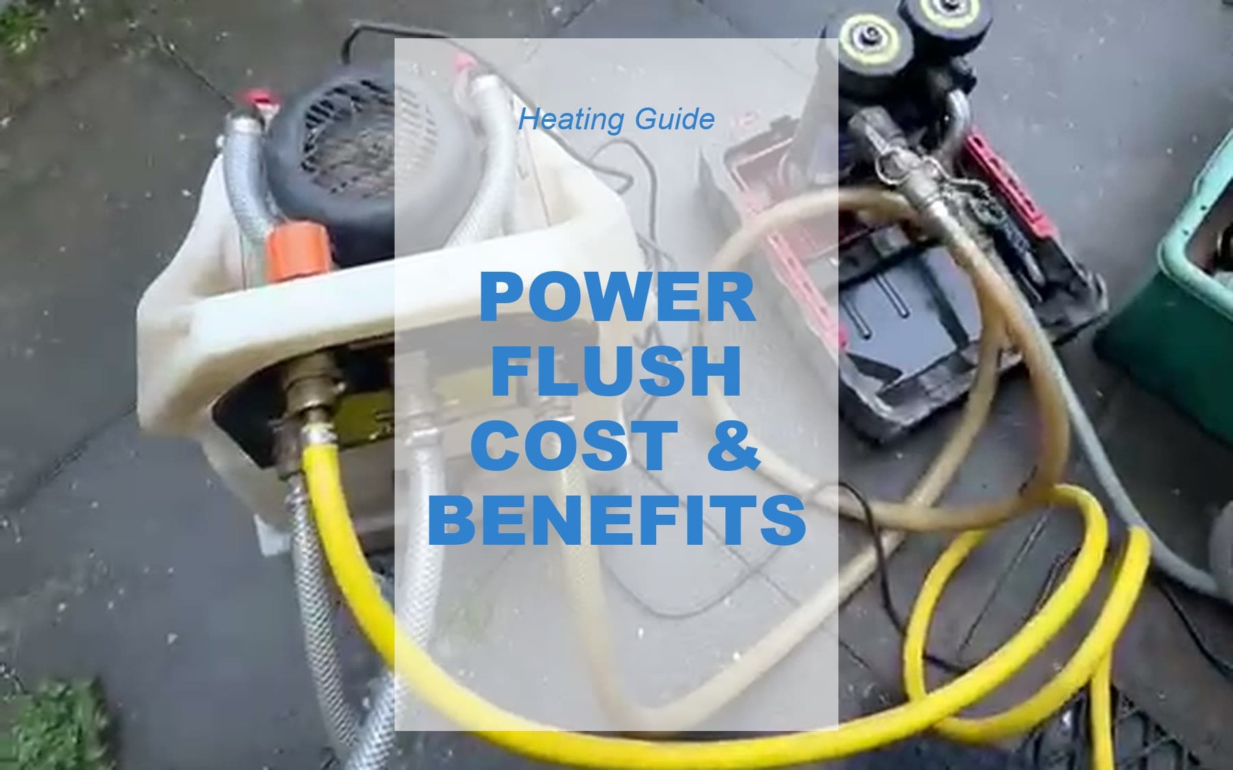 Power flushing equipment set up outside a property: the flush pump connected by hoses to a magnetic filter unit, ready to clean a central heating system.