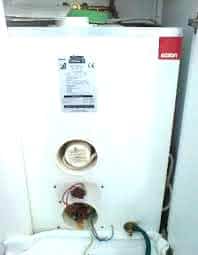 Elson Coral electric boiler with exposed internal parts – example of unit needing repair.