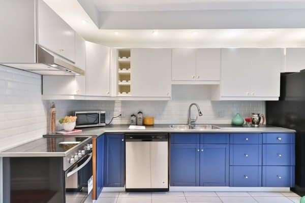 Modern kitchen with integrated stainless steel dishwasher – example of installed appliance.
