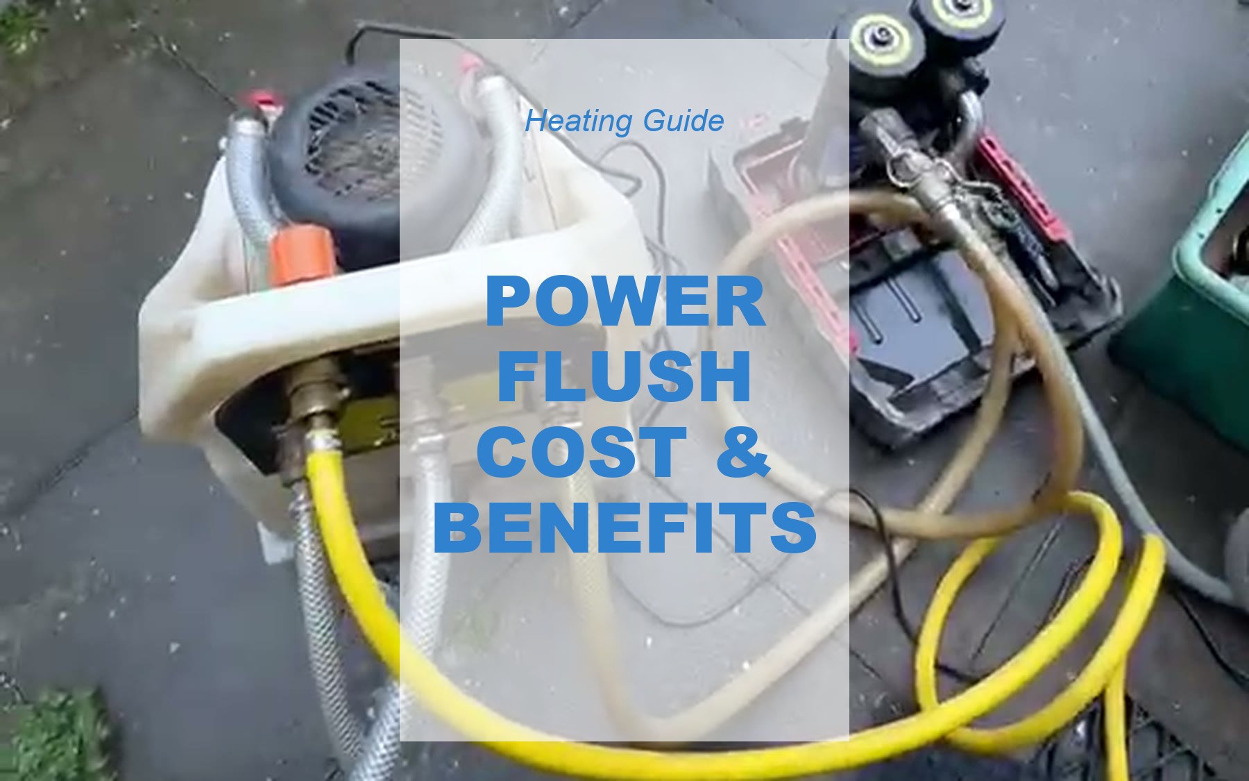 Power flushing equipment set up outside a property: the flush pump connected by hoses to a magnetic filter unit, ready to clean a central heating system.